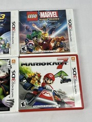 Nintendo 3DS XL Red Bundle w/ Charger, Stylus, SD Card, and 15 DS/3DS Games