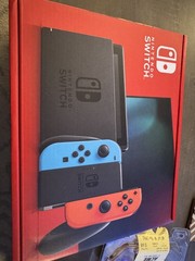 Brand NEW, NEVER used Nitendo Switch with controllers