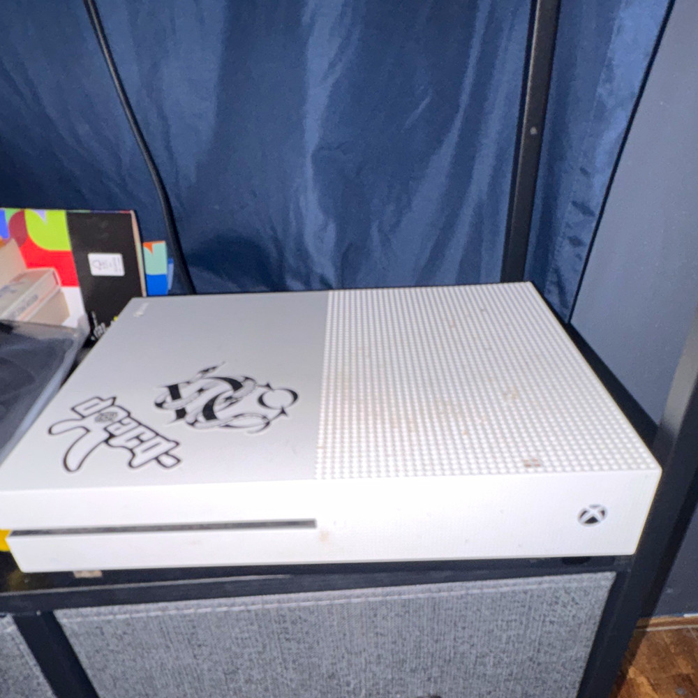 Xbox one s and camo blue controller also includes cord and hdmi runs really well