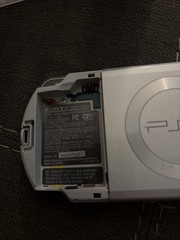 Sony PSP 2001 Handheld Console System Silver with 3 games and 1 movie.