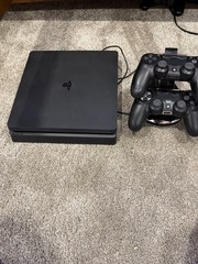 Sony PlayStation 4 Slim CUH-2215B 1TB Bundle 2 controllers, 4 games, and more