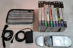PSP-2000 Ice Silver console, working condition, includes AC adapter and 10 games
