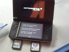 Nintendo DSi XL Bronze Handheld System – includes big brain academy and wipeout
