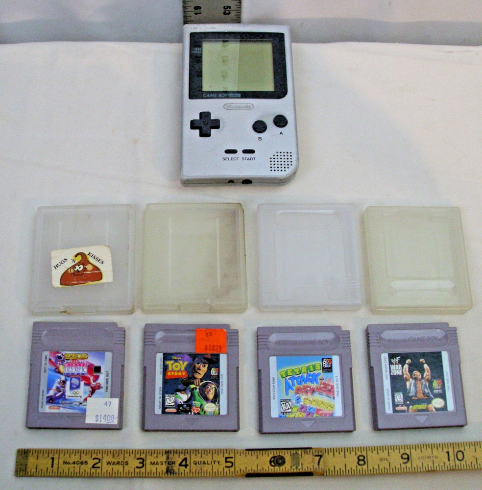 NINTENDO GAME BOY POCKET MODEL NO. MGB-001 WITH FOUR GAMES