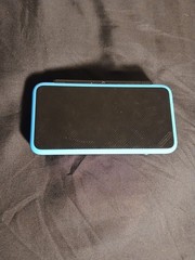 “New” Nintendo 2DS XL Console – Black/Blue US Region + metal gear solid 3d game