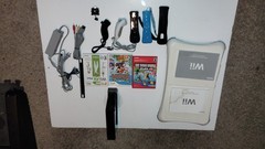 Nintendo Wii Console Bundle with Two Remotes & 3 Games And Wii Fit Board