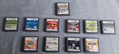 Nintendo DSi XL Handheld System – Midnight Blue w/ charger and 11 games bundle