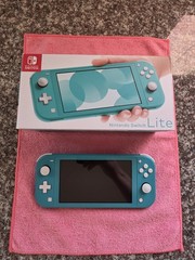 Nintendo Switch Lite Handheld Console – Turquoise With Game And Charger.