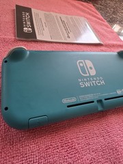 Nintendo Switch Lite Handheld Console – Turquoise With Game And Charger.