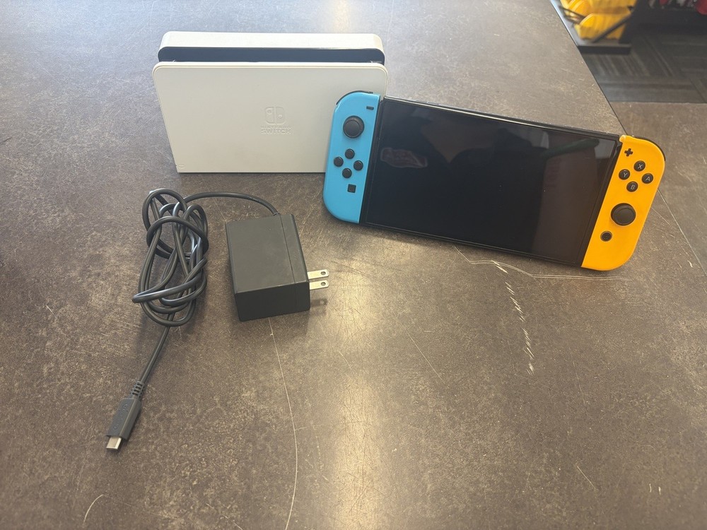 NINTENDO SWITCH OLED MODEL W/ NEON BLUE & NEON ORANGE JOY CONS