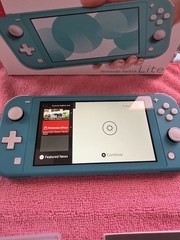 Nintendo Switch Lite Handheld Console – Turquoise With Game And Charger.