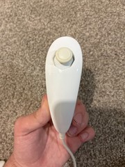 Nintendo Wii console, three controllers, four nunchucks, Wii steering wheel