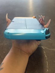 NINTENDO SWITCH OLED MODEL W/ NEON BLUE & NEON ORANGE JOY CONS