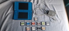 Nintendo DSi XL Handheld System – Midnight Blue w/ charger and 11 games bundle