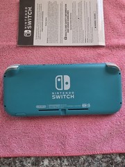 Nintendo Switch Lite Handheld Console – Turquoise With Game And Charger.