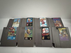 2 NES Consoles,8 Games,3 Controllers,2 Zappers, 2 Power Cables, 1 Supply Cable