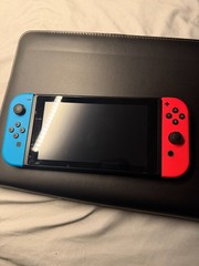 Nintendo Switch with Neon Blue and Neon Red Joy-Con